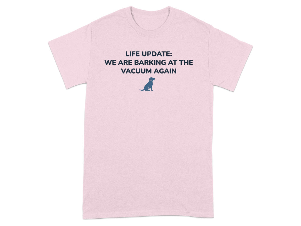 Pink t-shirt with text "LIFE UPDATE: WE ARE BARKING AT THE VACUUM AGAIN" and dog graphic.