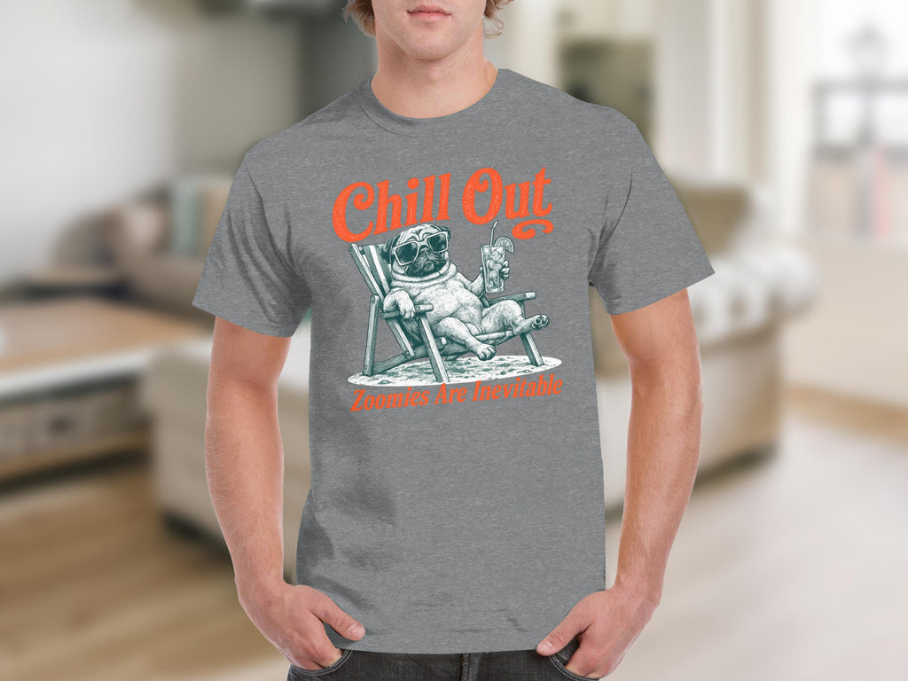 T-shirt graphic: pug in sunglasses relaxing in a beach chair with drink. "Chill Out" and "Zoomies Are Inevitable" text.