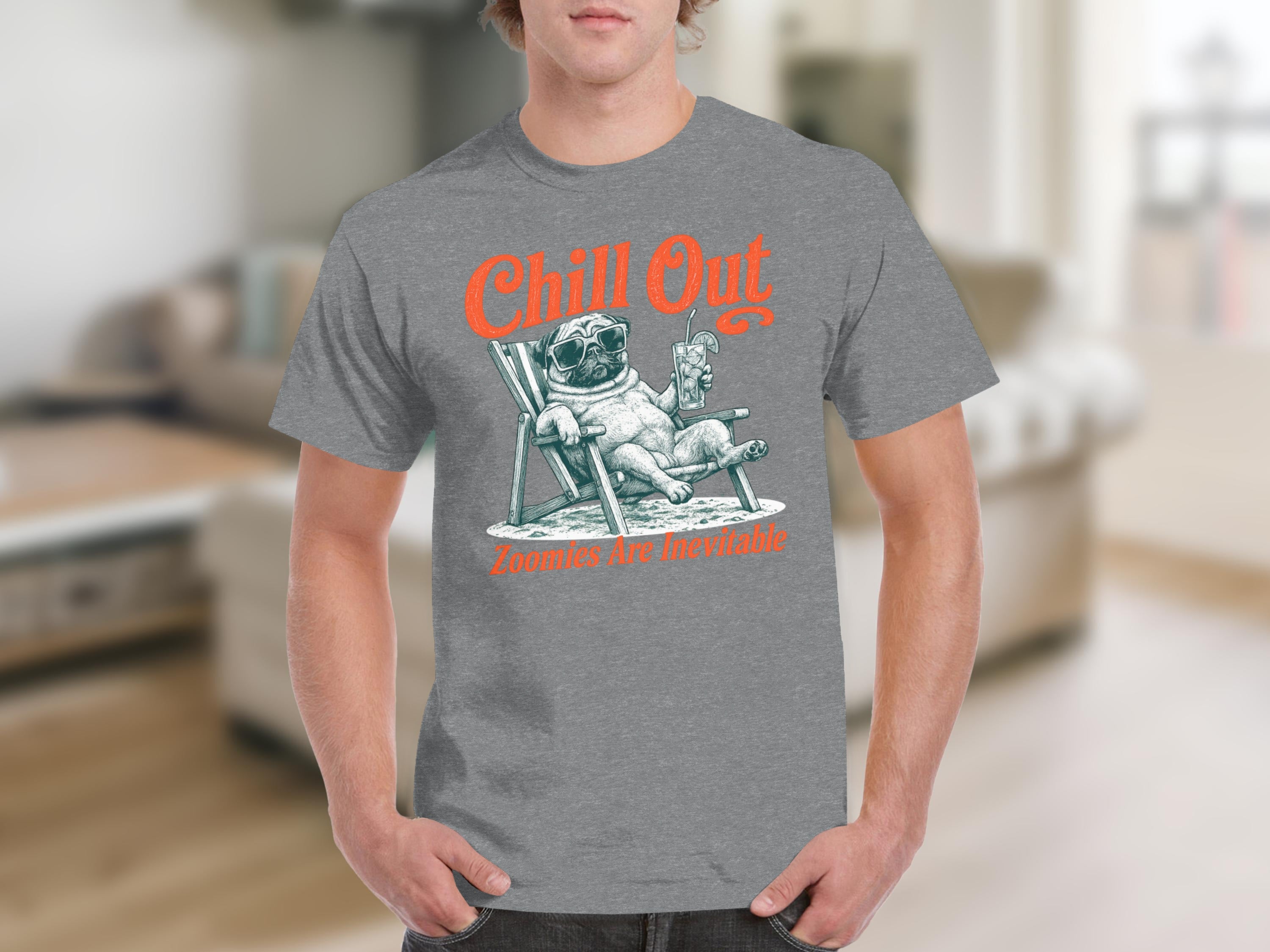 T-shirt graphic: pug in sunglasses relaxing in a beach chair with drink. "Chill Out" and "Zoomies Are Inevitable" text.