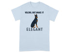 Light blue t-shirt with a Doberman wearing a bow tie and text "VELCRO, BUT MAKE IT ELEGANT".