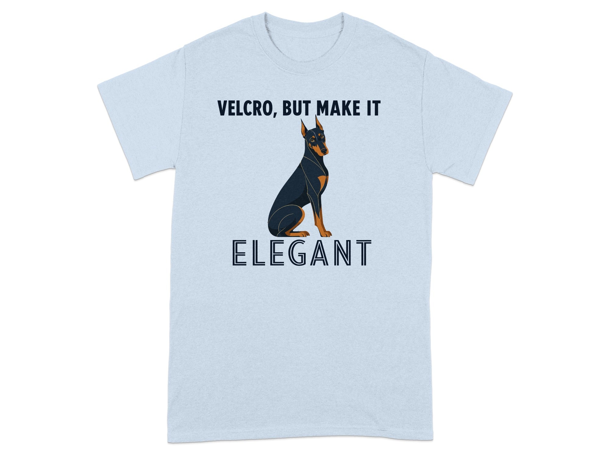 Light blue t-shirt with a Doberman wearing a bow tie and text "VELCRO, BUT MAKE IT ELEGANT".