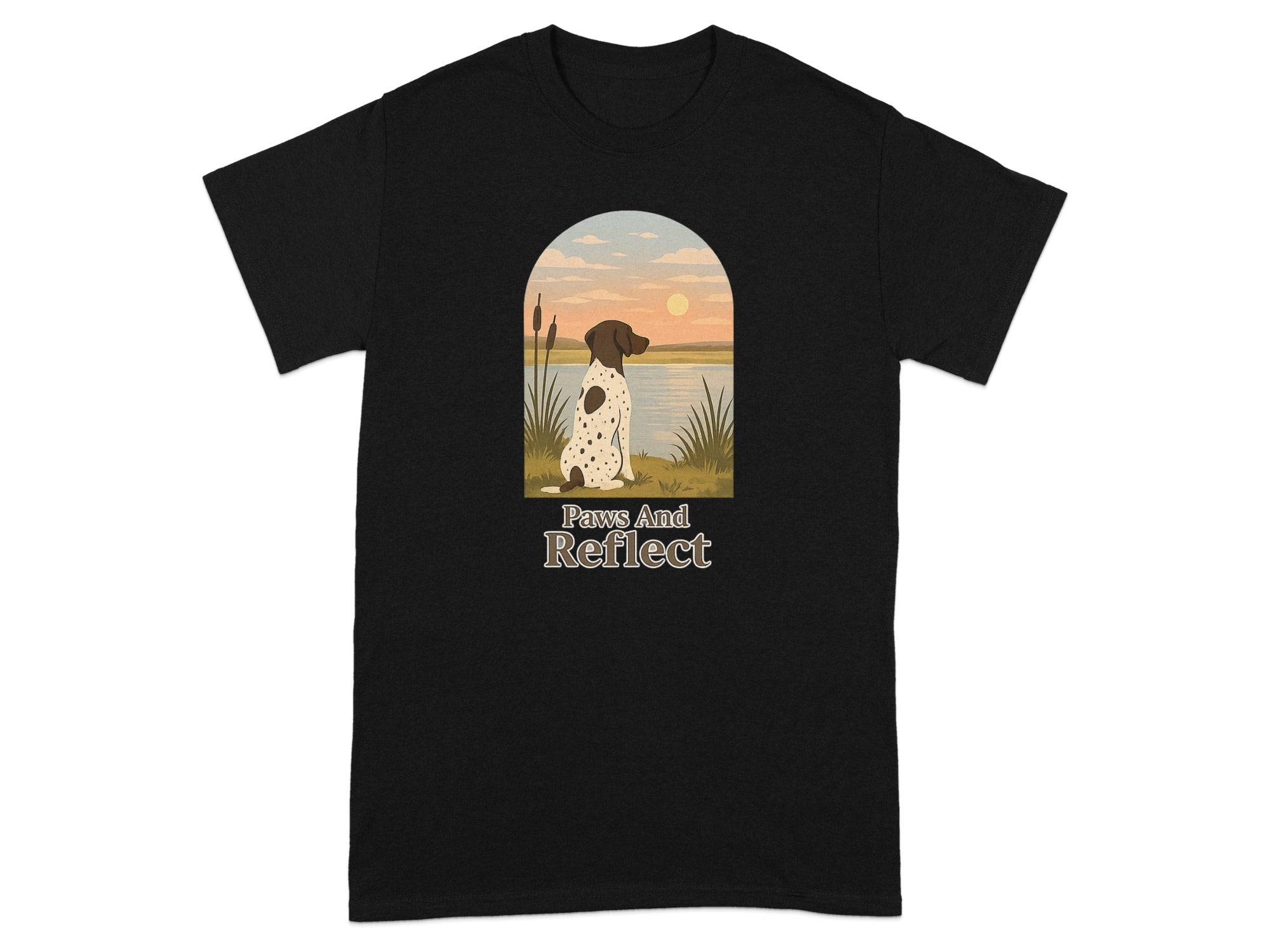 Black t-shirt featuring a German Shorthaired Pointer looking at a sunset over water, with text "Paws And Reflect".
