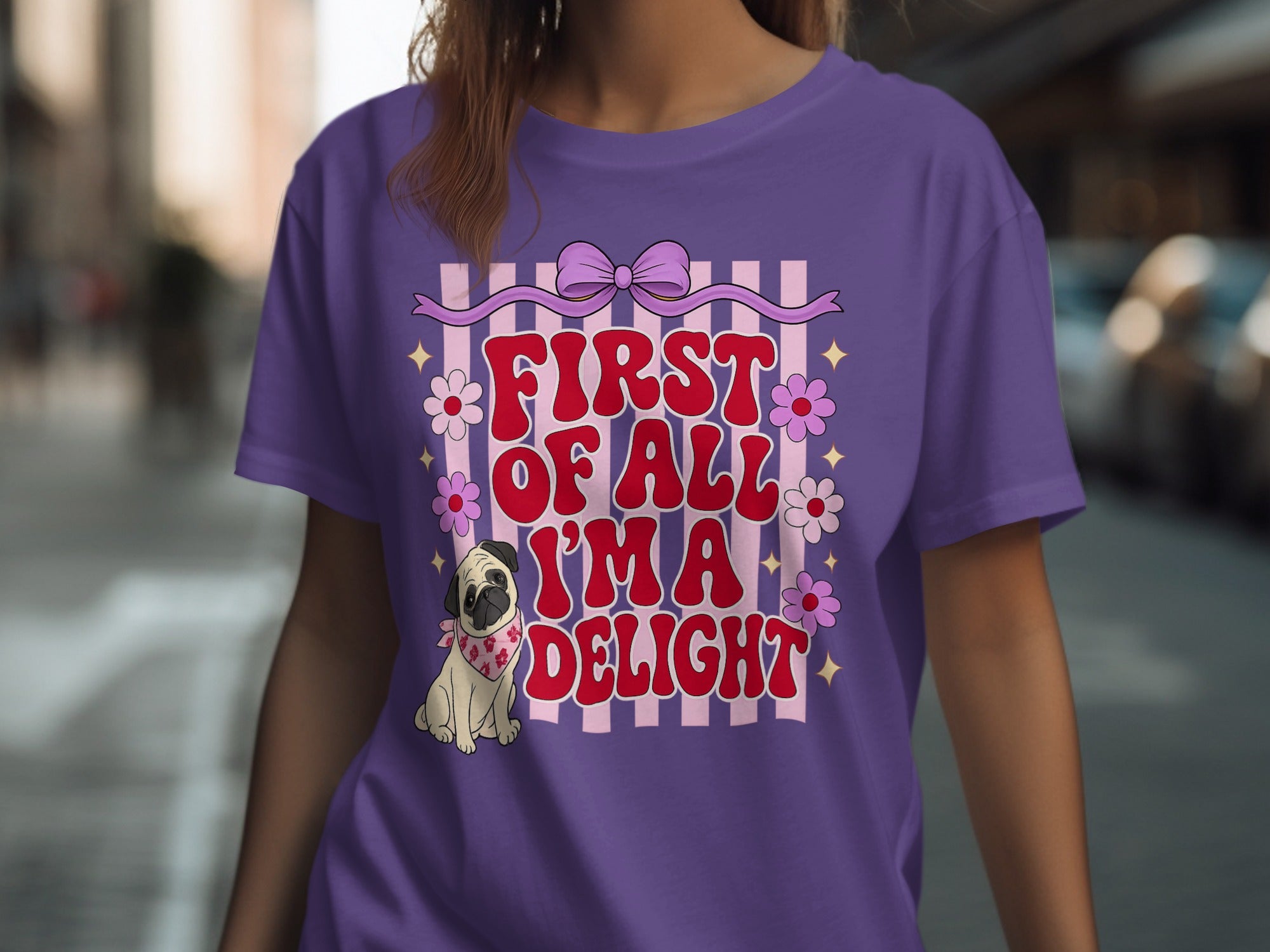 Purple t-shirt with pug graphic and text "First of all I'm a delight".