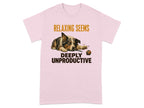 Pink t-shirt with a dog lying next to a ball, text reads "RELAXING SEEMS DEEPLY UNPRODUCTIVE".