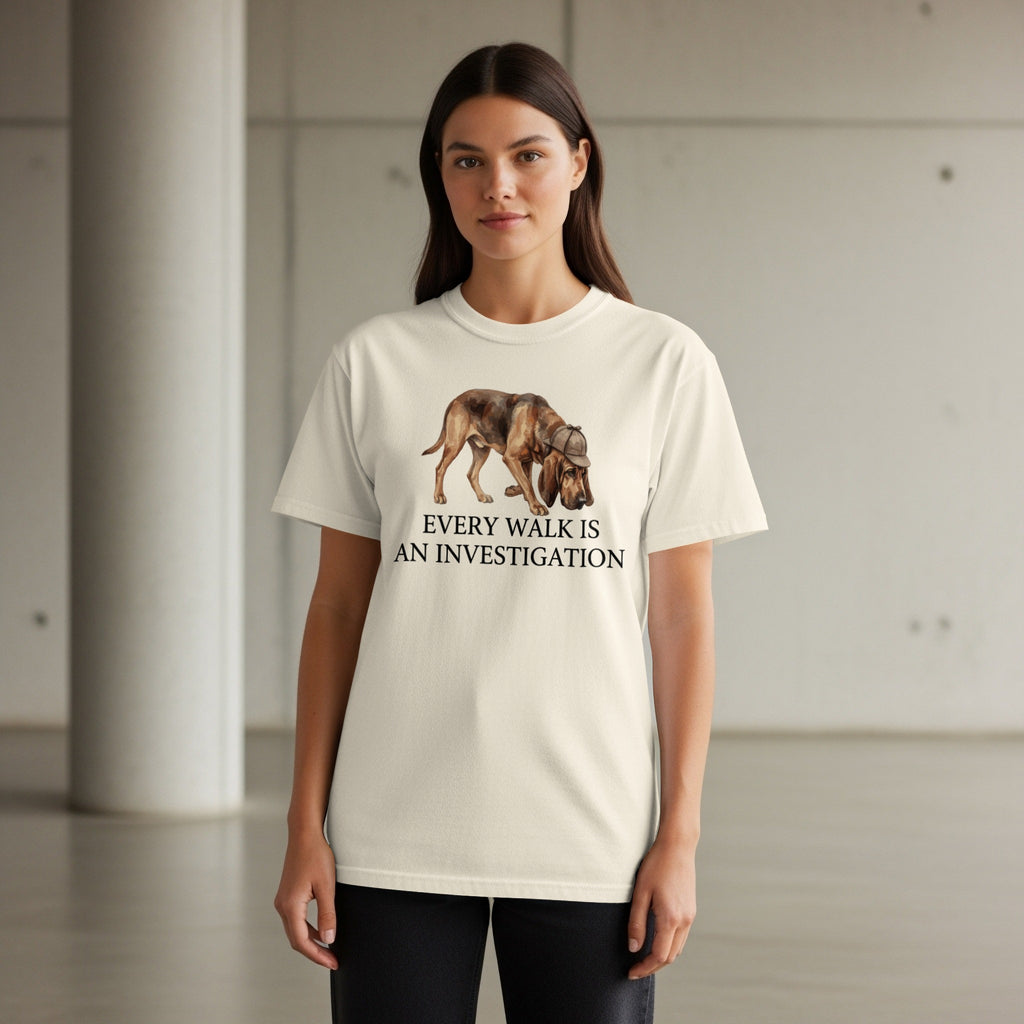 Cream t-shirt with illustration of a bloodhound and text "Every Walk is an Investigation".