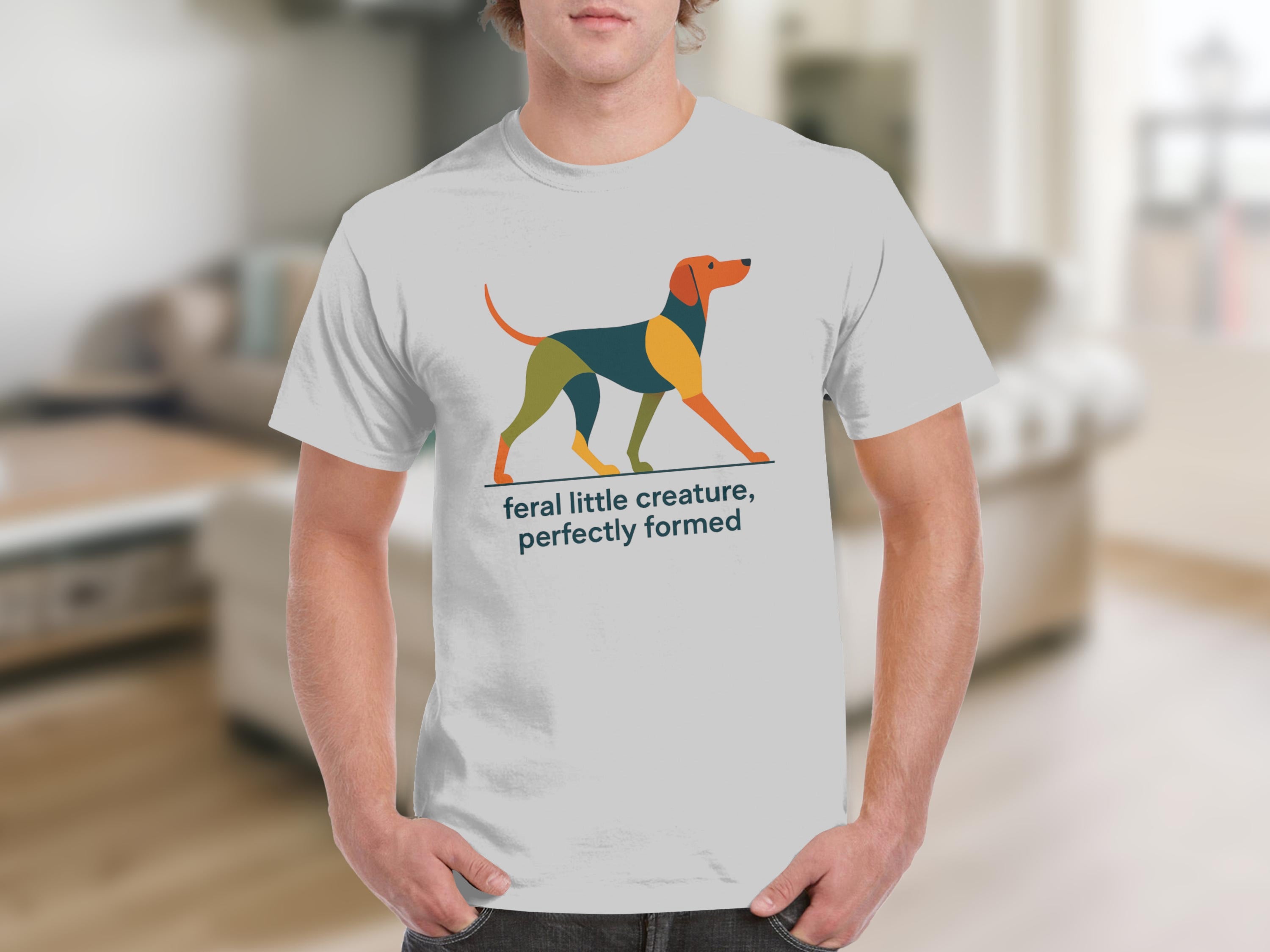 White t-shirt with abstract dog art and text "feral little creature, perfectly formed."