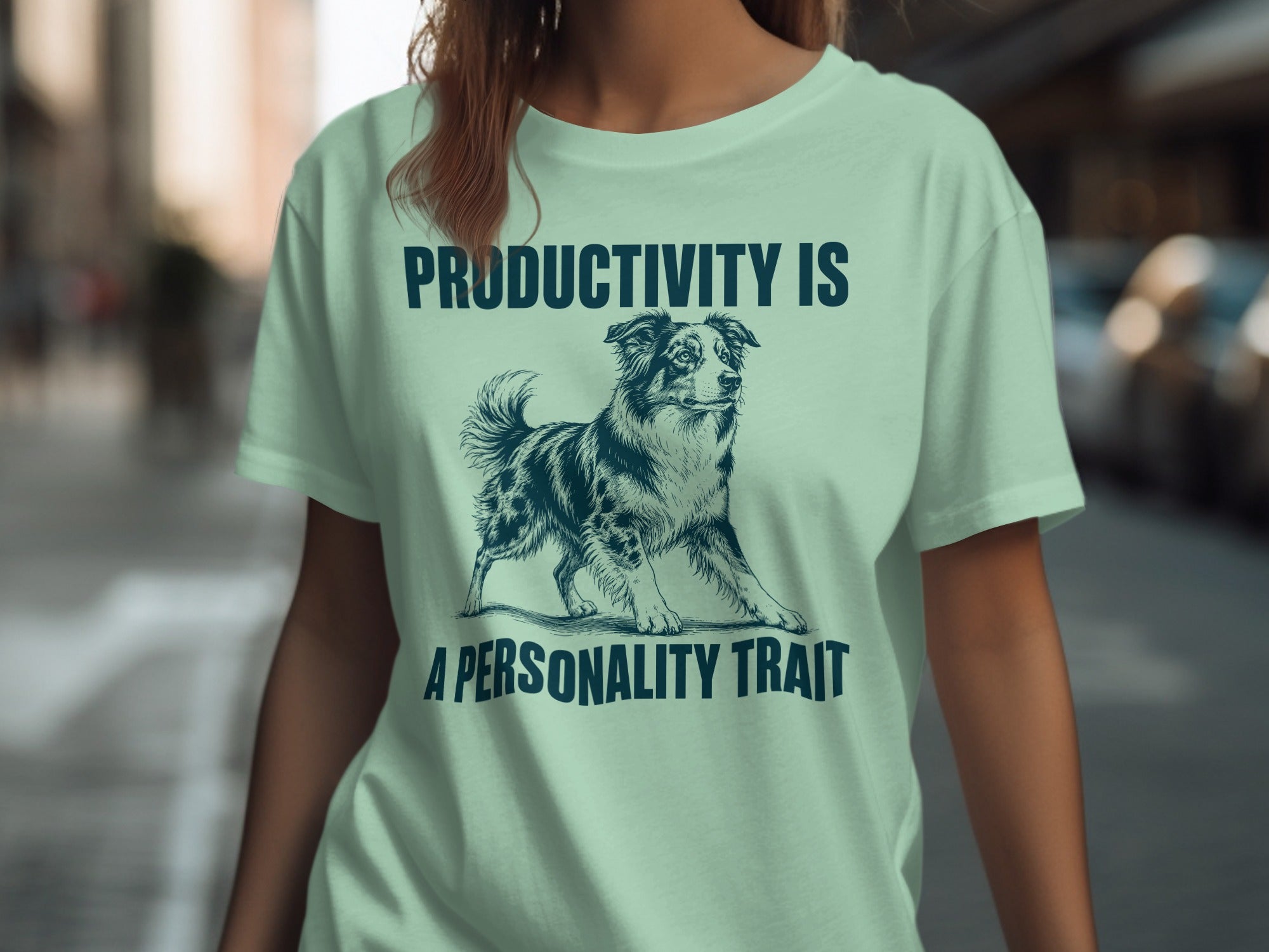 Light mint t-shirt with dog illustration and text "PRODUCTIVITY IS A PERSONALITY TRAIT".