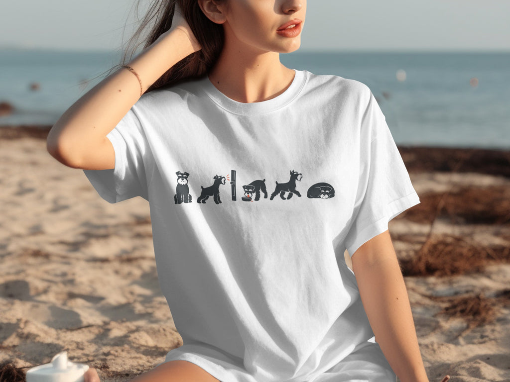 White t-shirt with stylized black schnauzer dog illustrations in different poses.