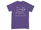 Purple t-shirt with outline of dog on leash and text "Slow down, enjoy walks"