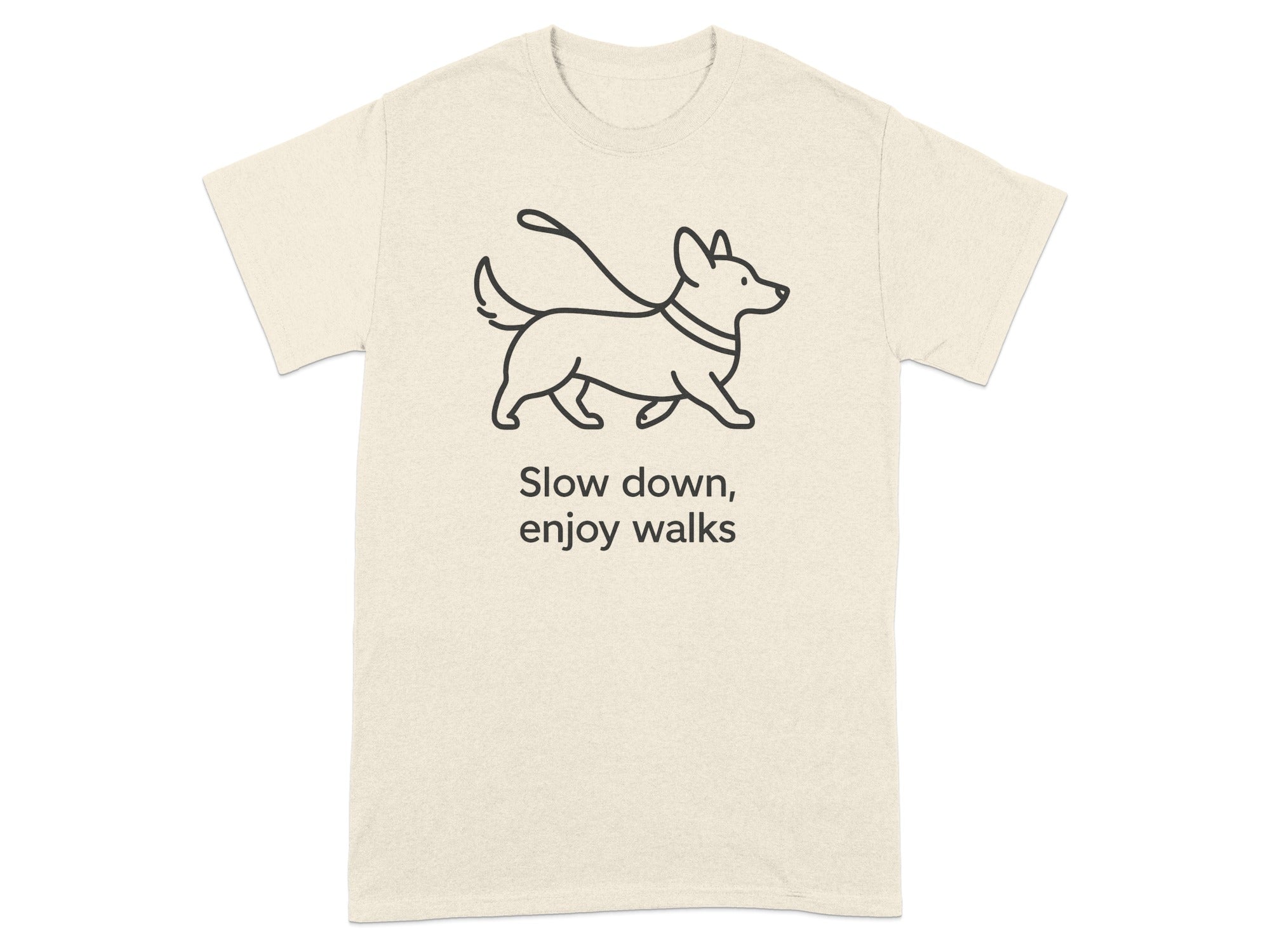 Cream t-shirt with black line drawing of a corgi on a leash and text.