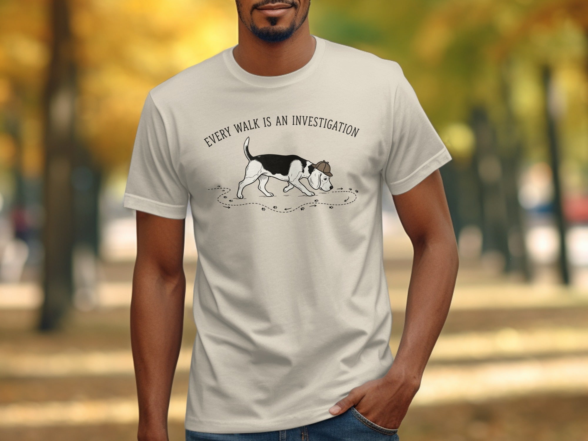 T-shirt with a dog sniffing the ground and the text "Every walk is an investigation."