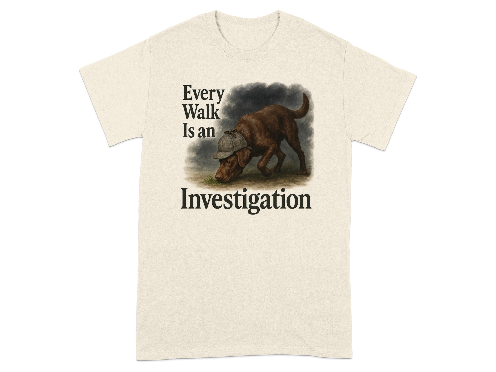 Cream t-shirt with a chocolate lab wearing a detective hat and the text "Every Walk Is an Investigation".