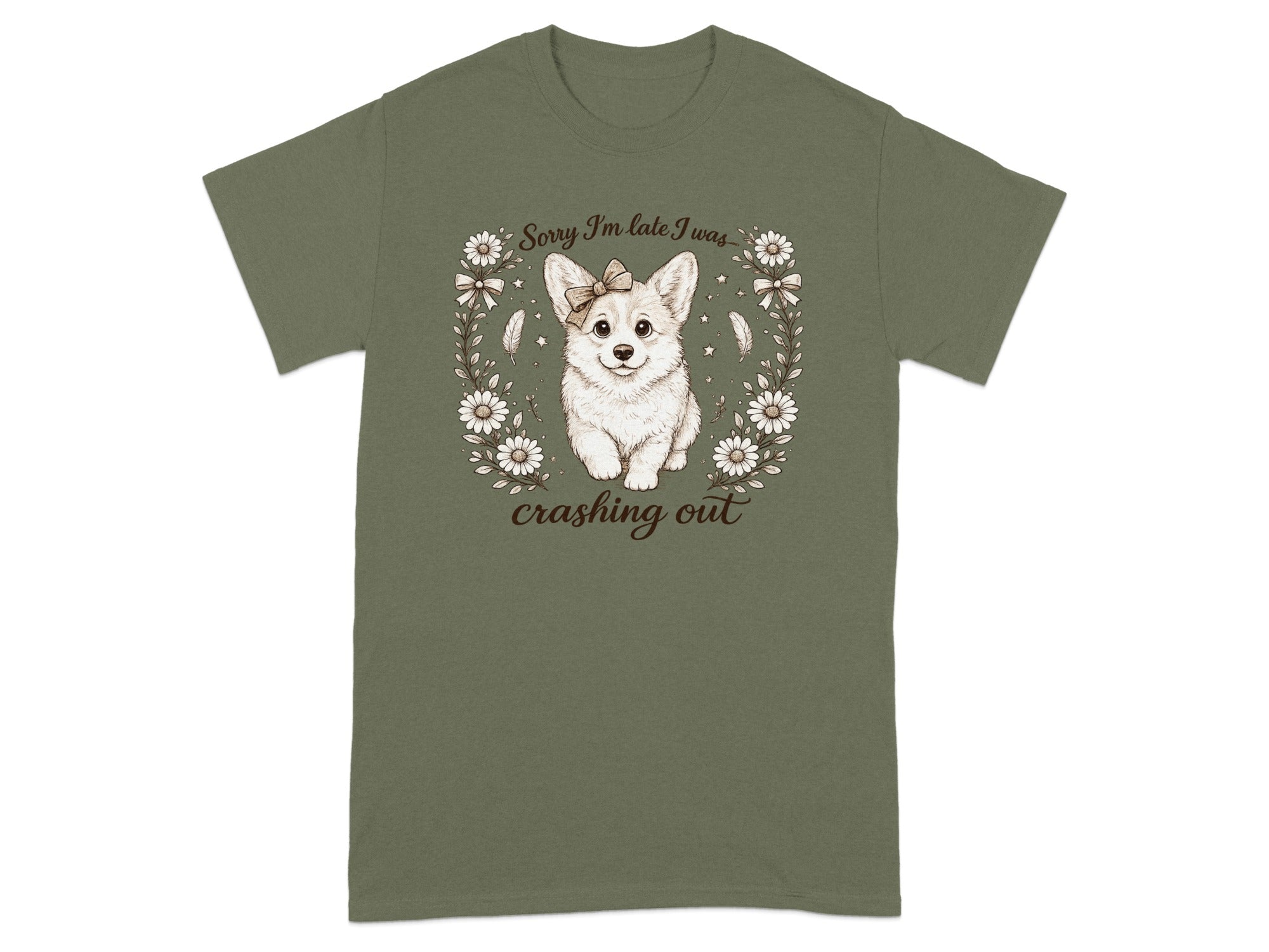 Green t-shirt with a corgi wearing a bow, surrounded by flowers and feathers. Text reads "Sorry I'm late I was crashing out".