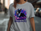 Boston Terrier running with colorful paint splashes, reads "Unleash the Joy".