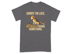 Dark grey t-shirt with "Sorry I'm late. My Beagle found something." and a beagle on a leash.