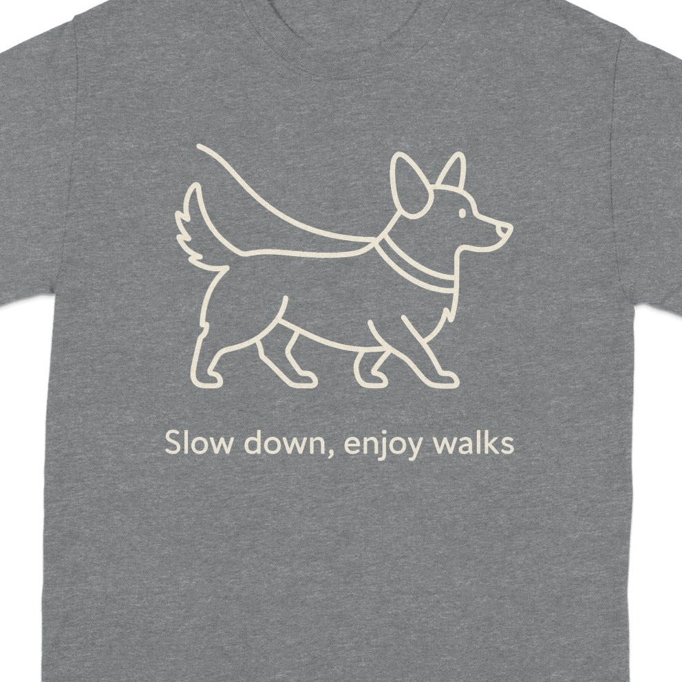 Gray t-shirt with a line drawing of a corgi and text "Slow down, enjoy walks".