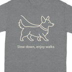 Gray t-shirt with a line drawing of a corgi and text "Slow down, enjoy walks".