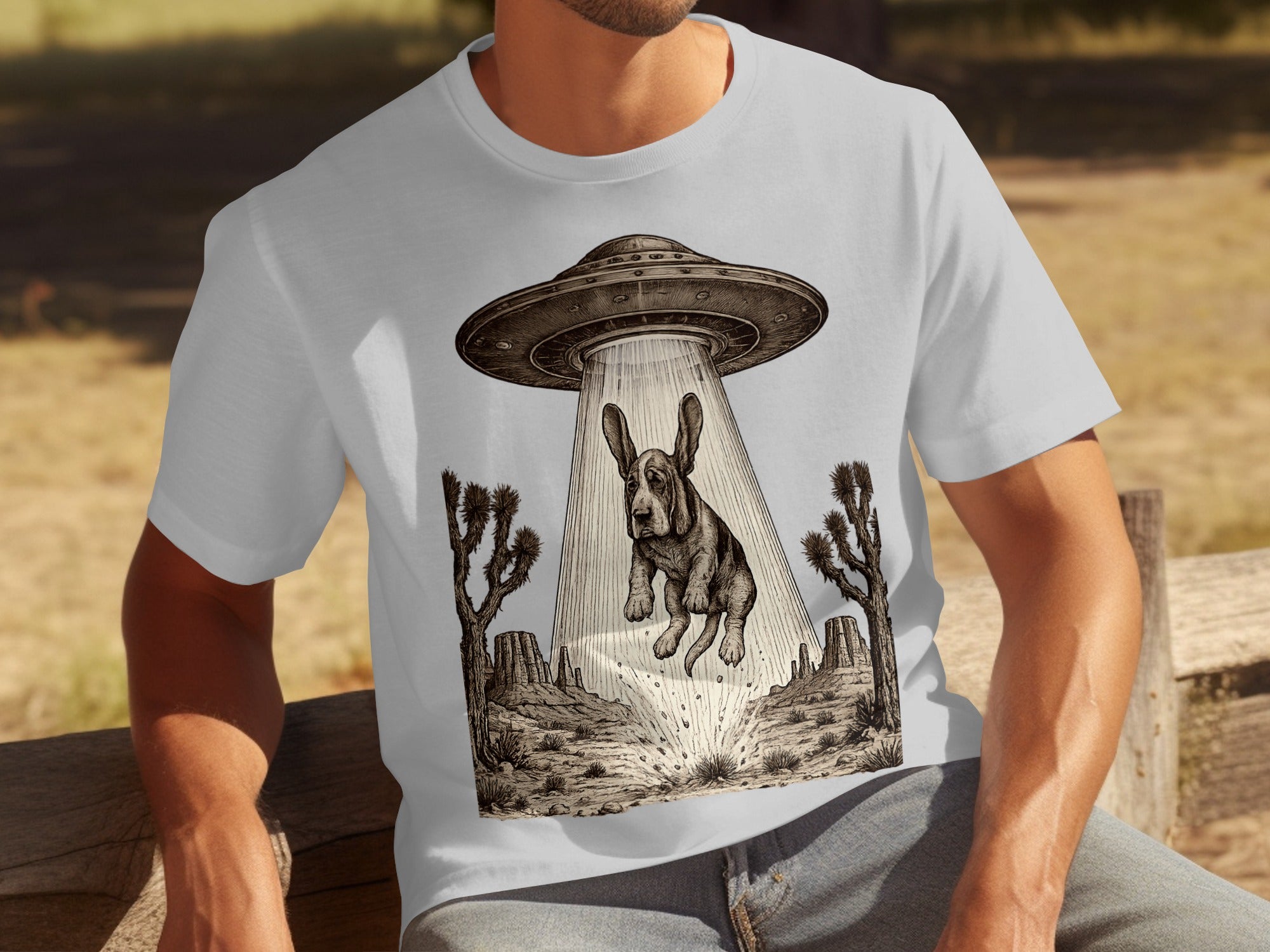 Basset hound being abducted by a UFO in a desert landscape.