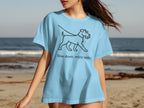 Light blue t-shirt with a line drawing of a walking dog and the text "Slow down, enjoy walks".