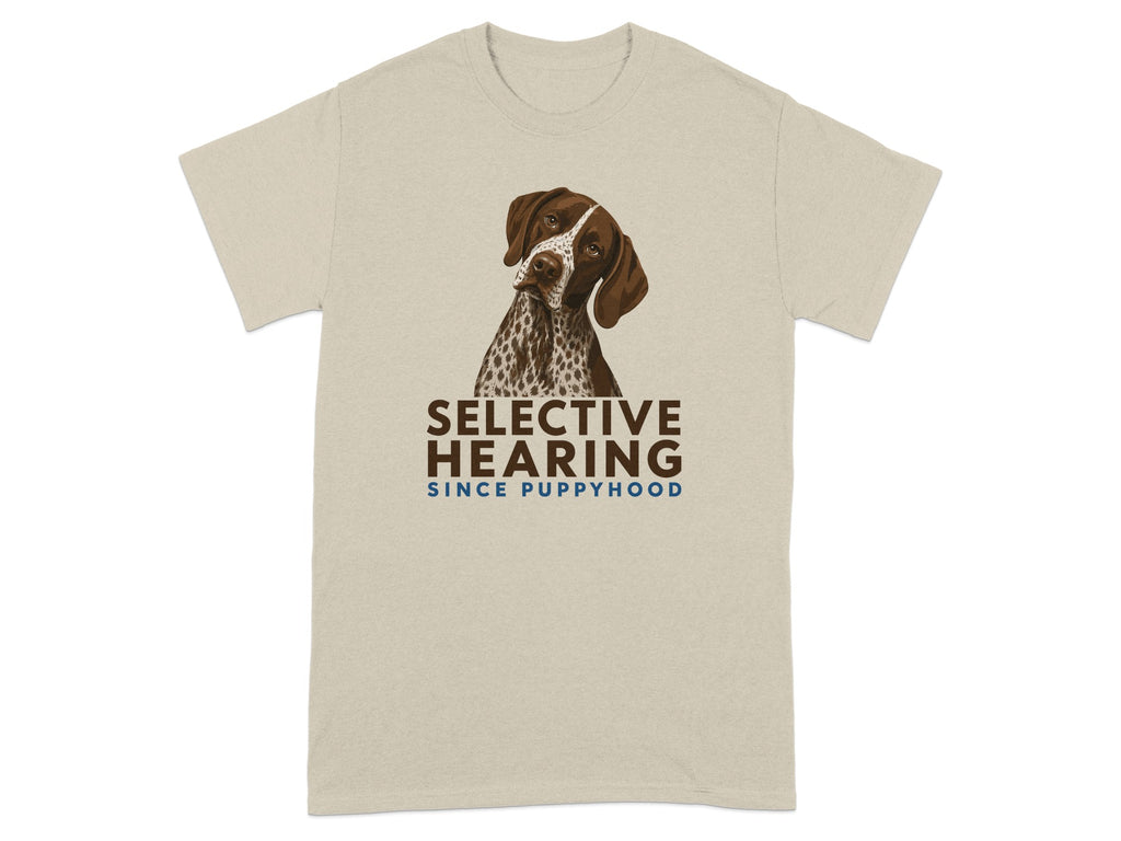 Beige t-shirt with graphic of a German Shorthaired Pointer and "SELECTIVE HEARING SINCE PUPPYHOOD" text.
