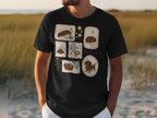 Black t-shirt with embroidered dachshund illustrations in decorative frames.