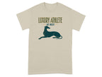 Beige t-shirt with "LUXURY ATHLETE AT REST" and a greyhound silhouette.