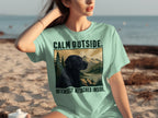Mint green t-shirt with black lab and mountains, reading "CALM OUTSIDE. INTENSELY ATTACHED INSIDE."