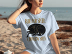 Light blue t-shirt with sleeping black dog graphic and text.