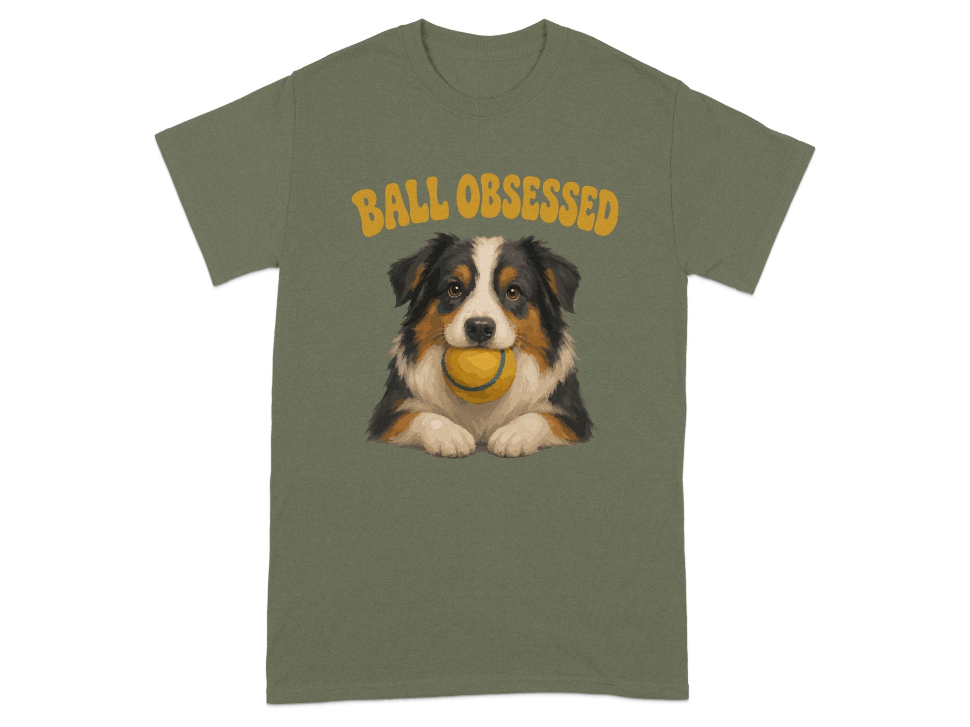 Green t-shirt with "BALL OBSESSED" text above a dog holding a tennis ball.