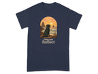 Black Labrador dog sits watching sunset over rocky coast with text "Paws And Reflect".