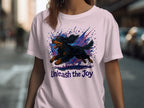 T-shirt with a black dog illustration and "Unleash the Joy" text.