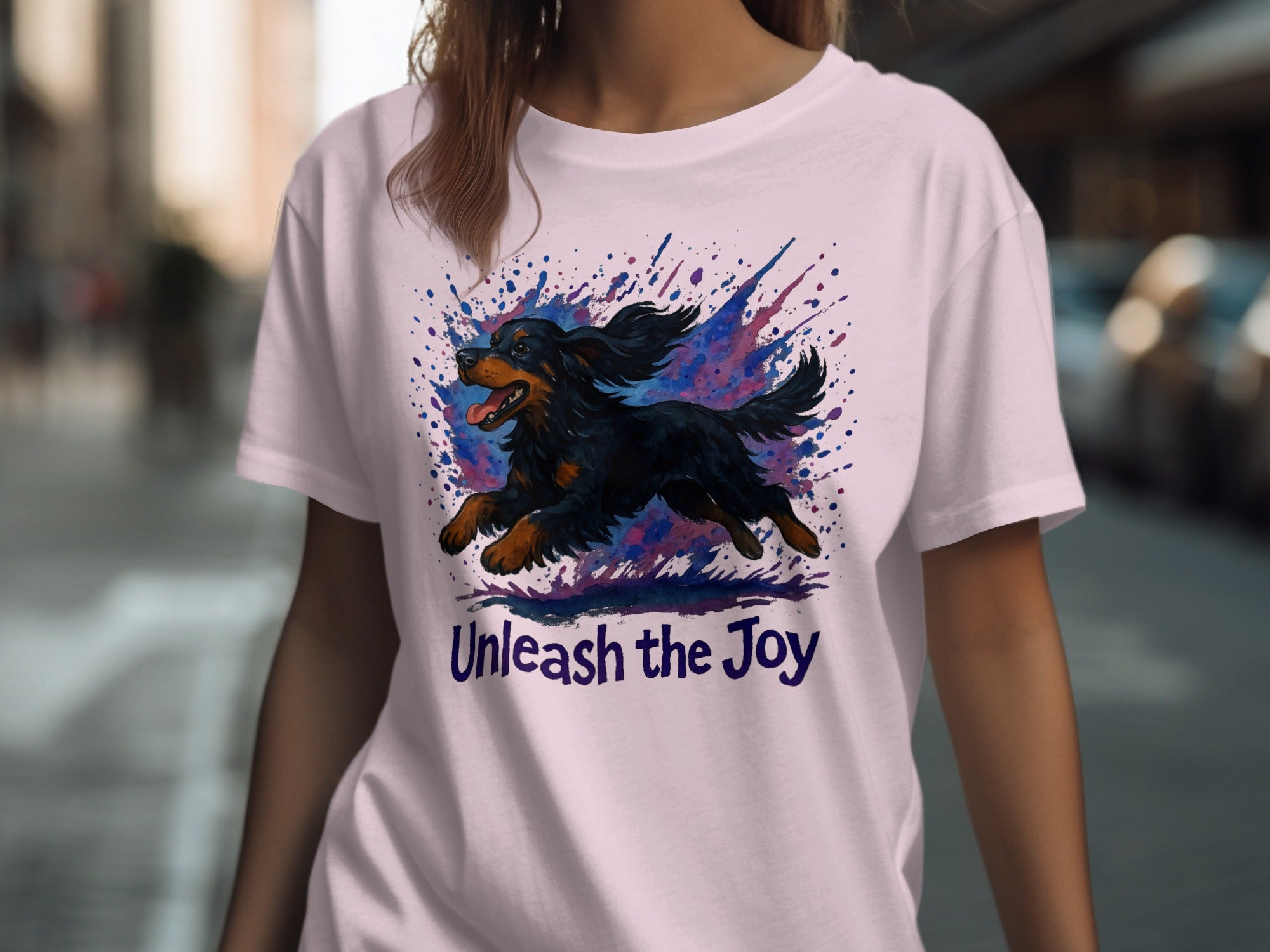 T-shirt with a black dog illustration and "Unleash the Joy" text.