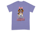 Beagle wearing sunglasses and a pink bow, with text "First of all, I'm a delight".