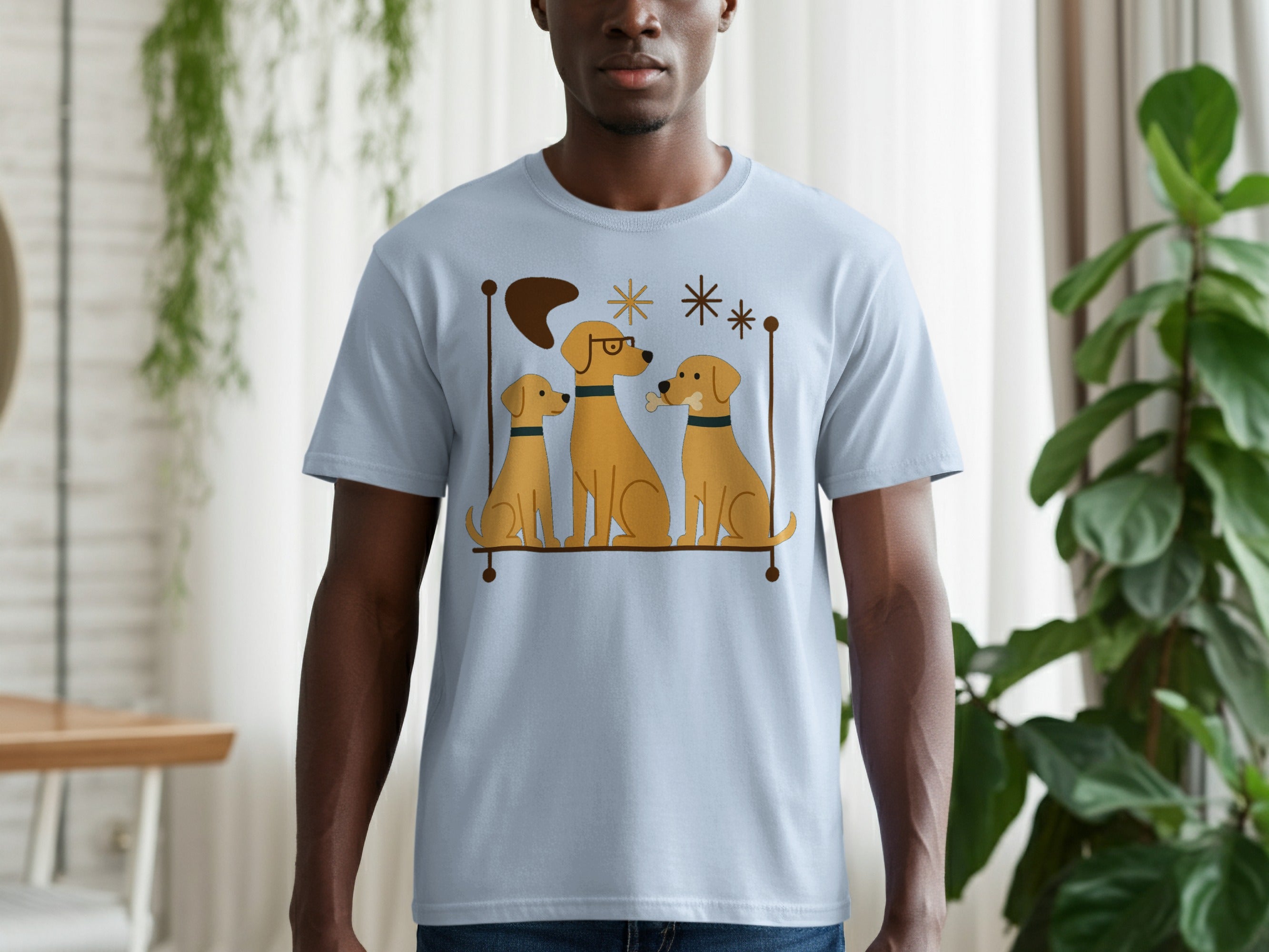 Light blue t-shirt with a graphic of three yellow dogs sitting on a shelf, one wearing glasses.