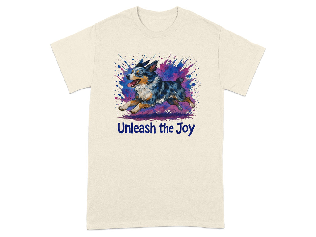 Cream t-shirt with a watercolor Australian Shepherd running through a colorful splash with text "Unleash the Joy".