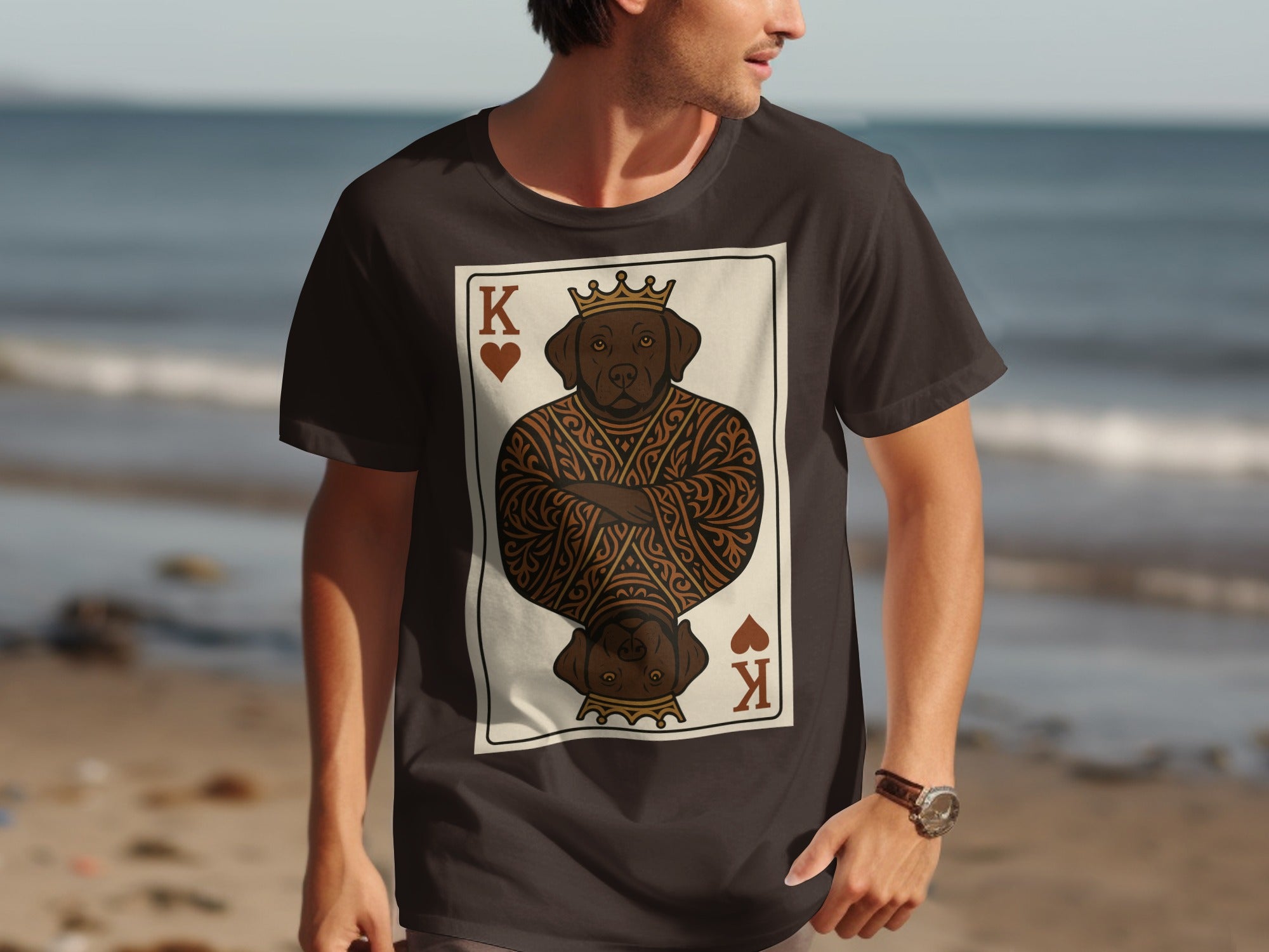 Dark t-shirt featuring a chocolate lab playing card design on beach background.