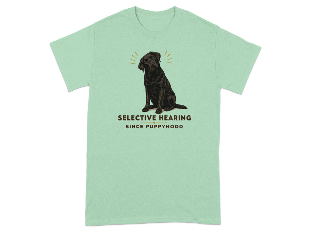 Black labrador dog illustration with "SELECTIVE HEARING SINCE PUPPYHOOD" text on mint green t-shirt.