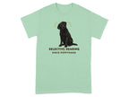 Black labrador dog illustration with "SELECTIVE HEARING SINCE PUPPYHOOD" text on mint green t-shirt.
