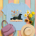 Gordon Setter Resting on Book Amidst Blooms Garden Art T-Shirt in Light Blue