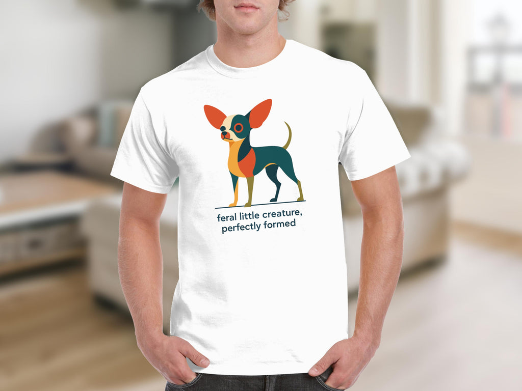 White t-shirt with graphic of a stylized dog and text "feral little creature, perfectly formed".