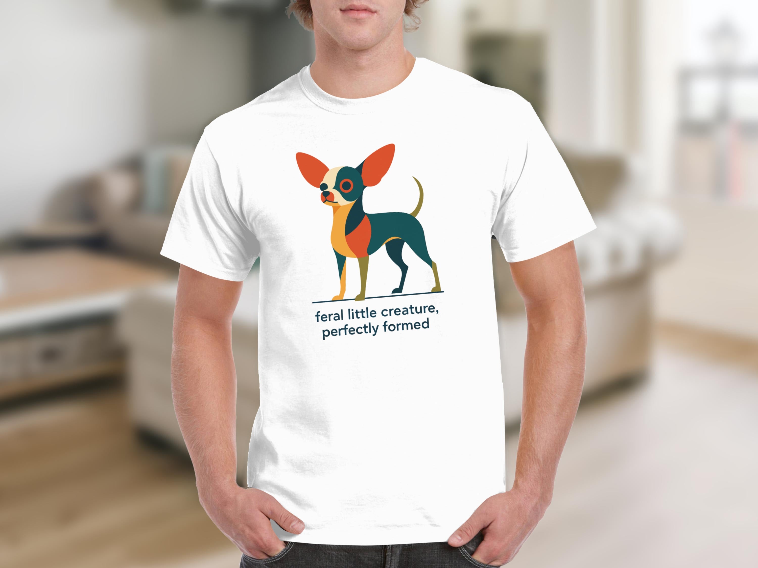 White t-shirt with graphic of a stylized dog and text "feral little creature, perfectly formed".
