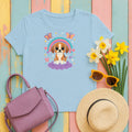 Cute Puppy Beagle Above Rainbow Cloud Design Graphic T-Shirt in Light Blue