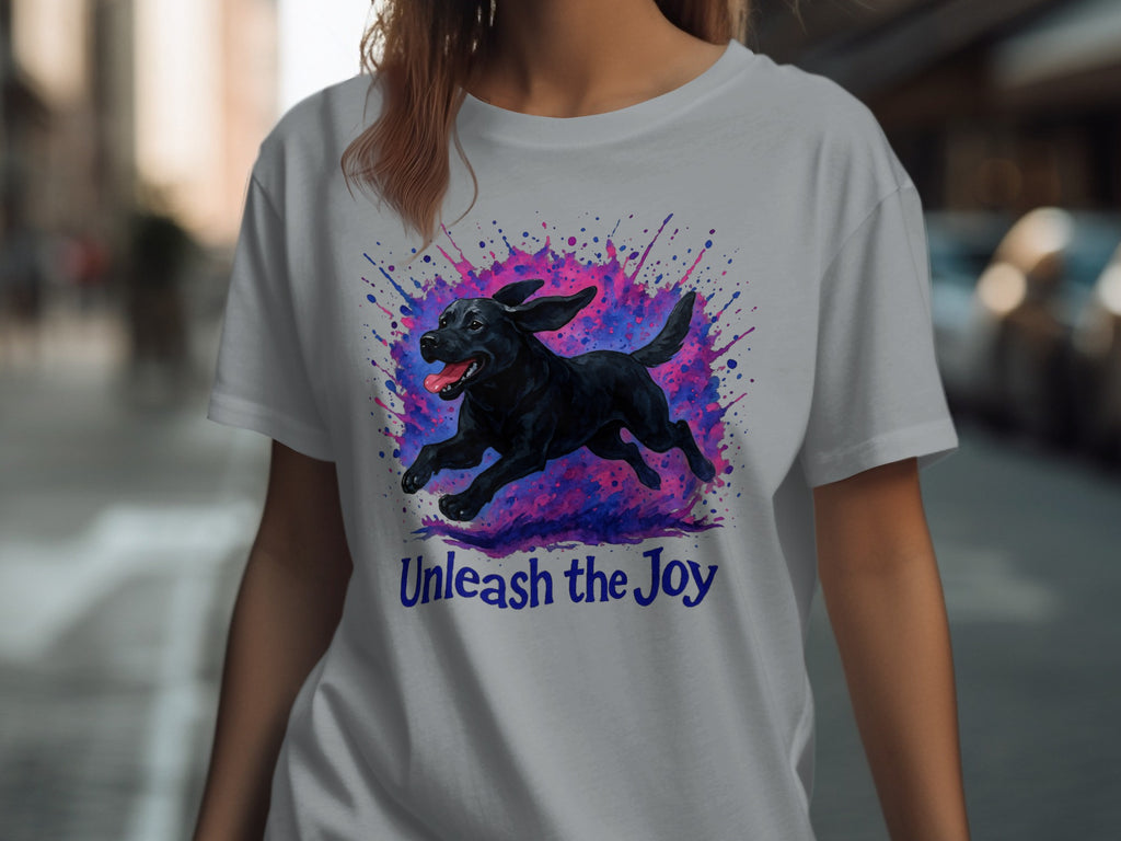 Black dog running against colorful ink splash with "Unleash the Joy" text.