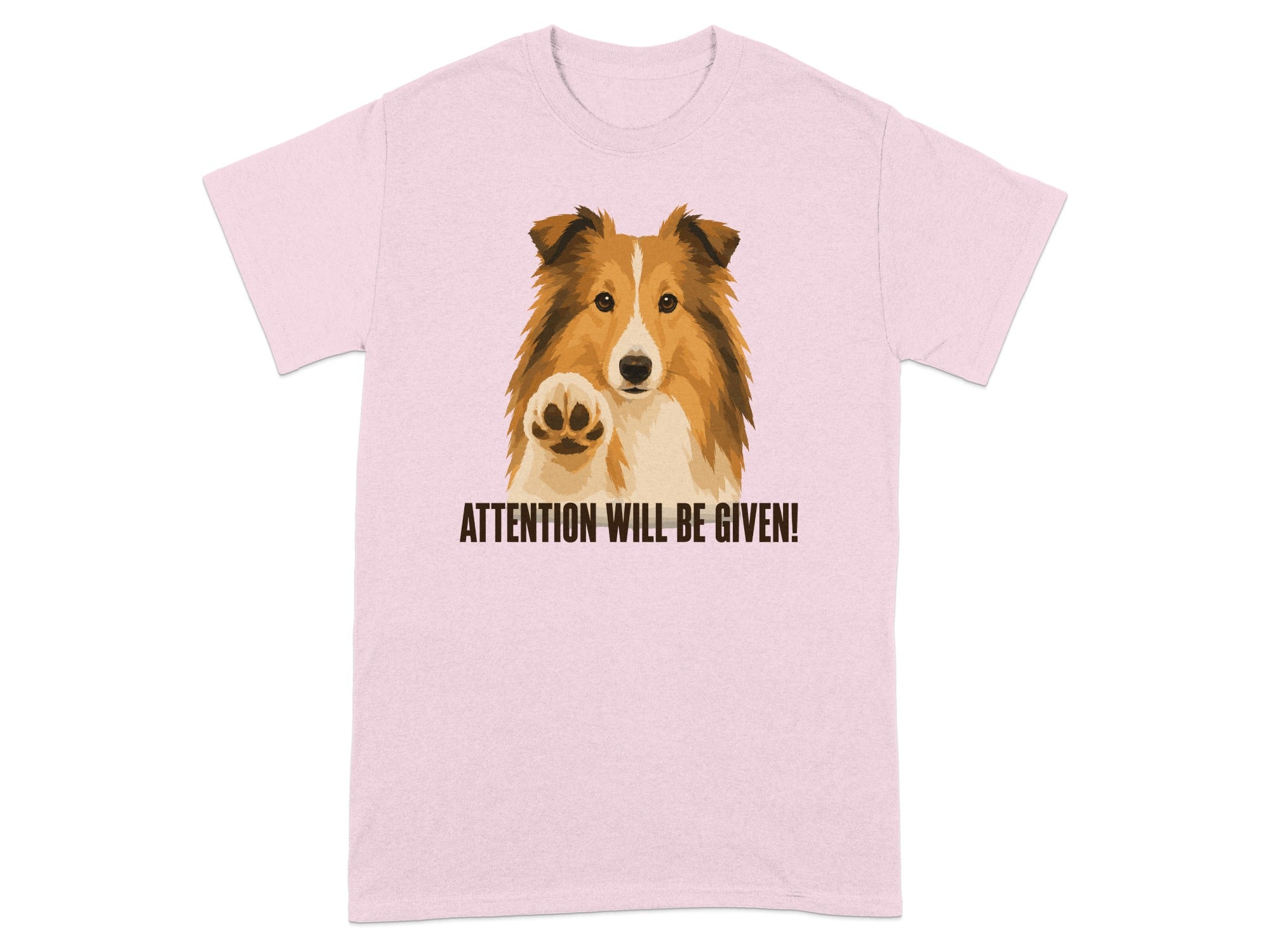 Sheltie dog with paw raised on pink t-shirt saying "ATTENTION WILL BE GIVEN!"