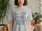 Light gray t-shirt with a black line drawing of a dog and text.