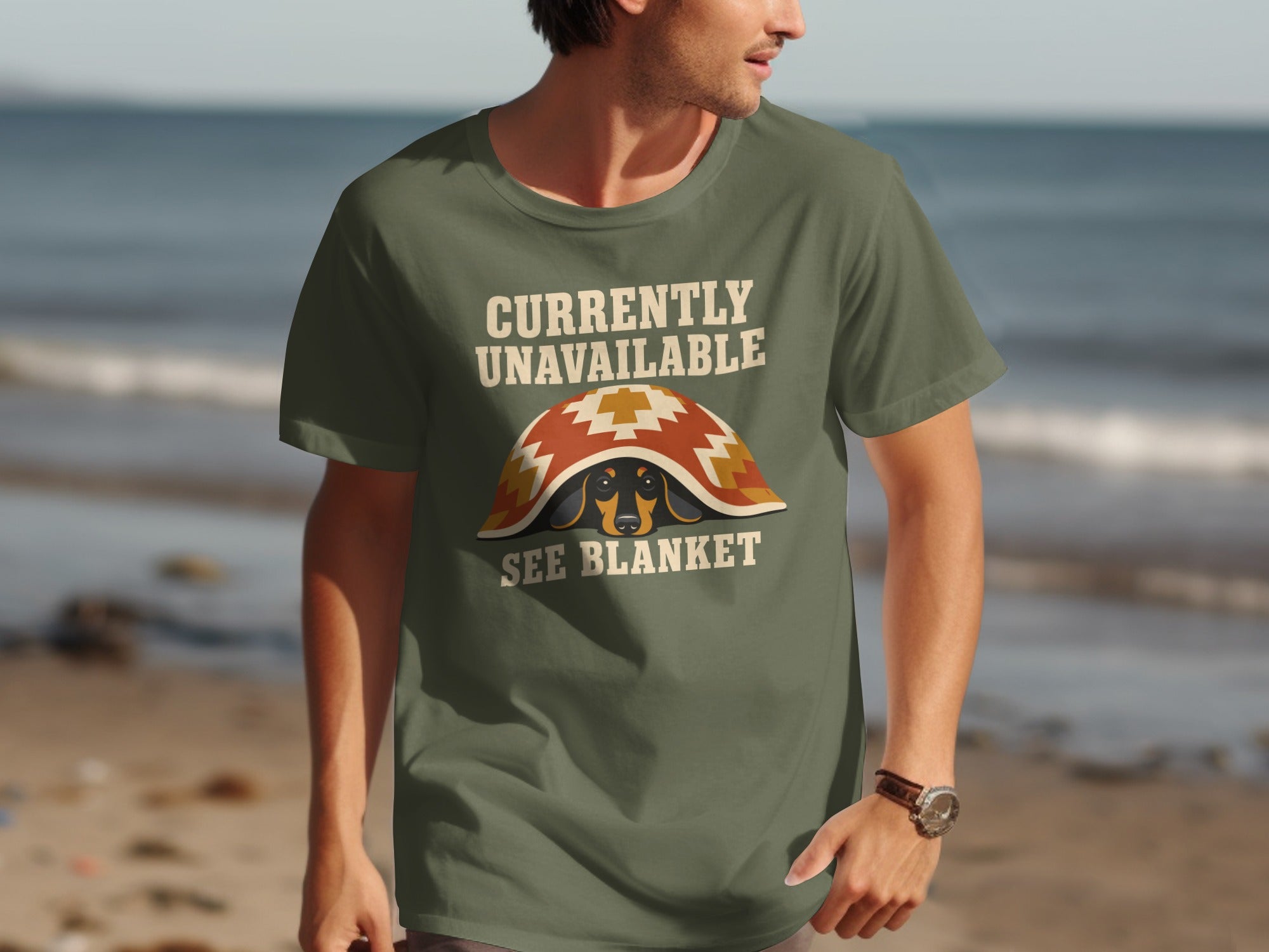 Olive t-shirt with "Currently Unavailable See Blanket" and a dachshund under a blanket.