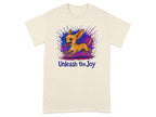 Cream t-shirt with a running chihuahua in front of a colorful abstract paint splatter and text "Unleash the Joy."
