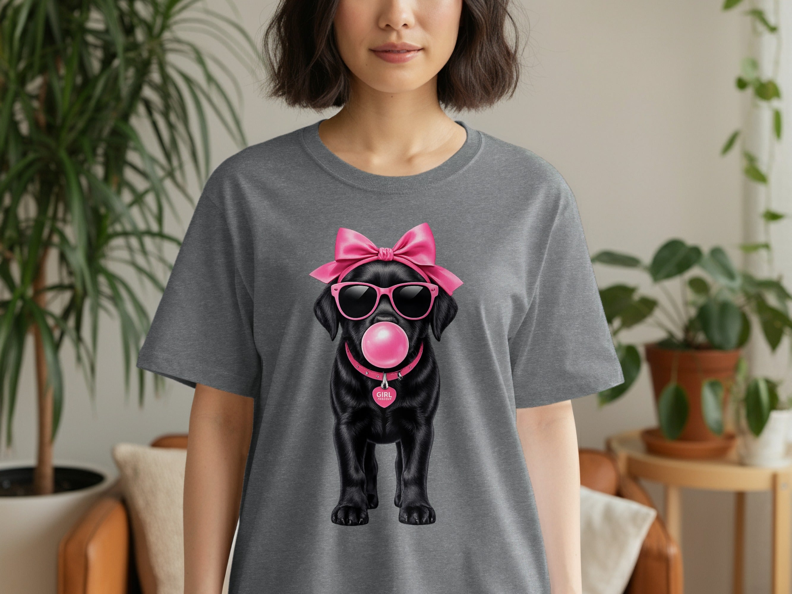 Black labrador wearing sunglasses, pink bow, blowing bubble gum, with "GIRL" on collar.
