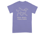 Purple t-shirt with a tan line drawing of a dog on a leash and text.