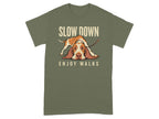 T-shirt featuring a dog with text "SLOW DOWN ENJOY WALKS".